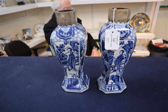 A pair of Chinese blue and white canted rectangular baluster vases, Kangxi period, H.26.7cm, one neck with section lacking obscured by